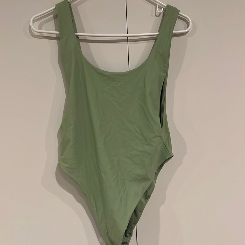 green one piece bathing suit. Open back!